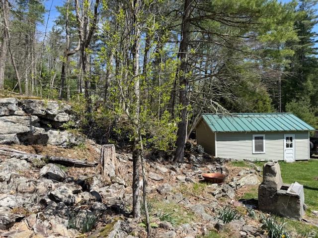 26 Woods Road Barryville, NY 12719 - Photo 27 of 34 a view of backyard with a patio and outdoor seating