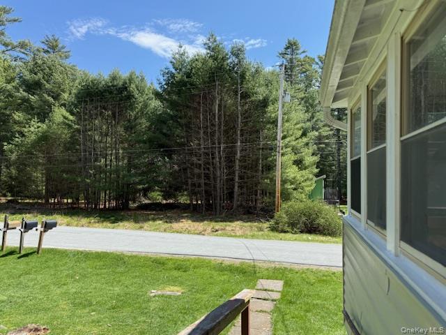26 Woods Road Barryville, NY 12719 - Photo 30 of 34 a view of a swimming pool with a yard