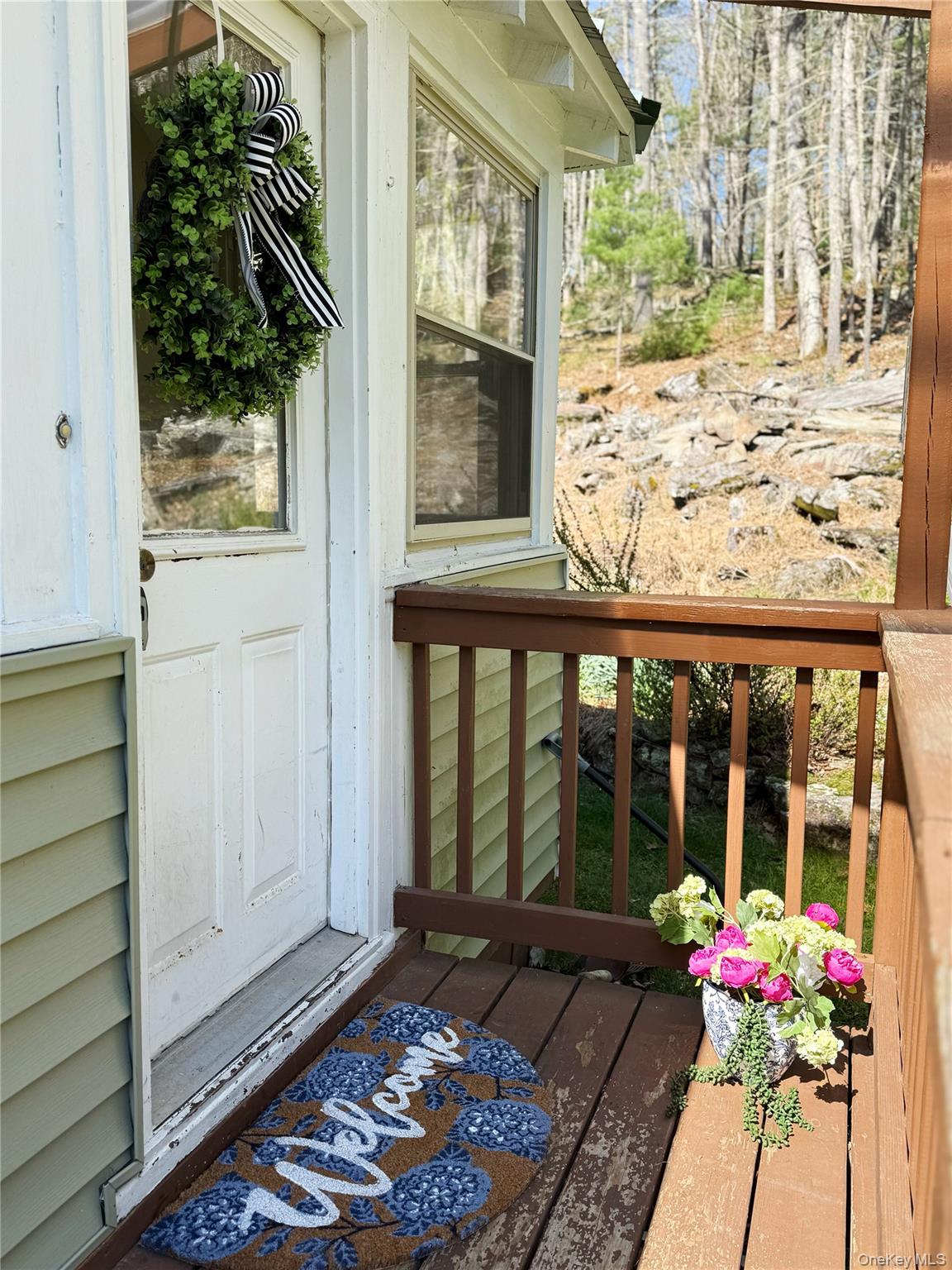 26 Woods Road Barryville, NY 12719 - Photo 3 of 34 a flower garden in front of a window