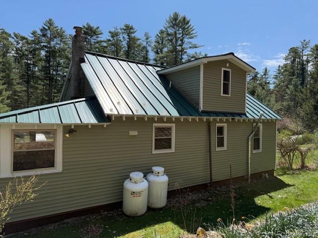26 Woods Road Barryville, NY 12719 - Photo 32 of 34 a front view of a house with a garden