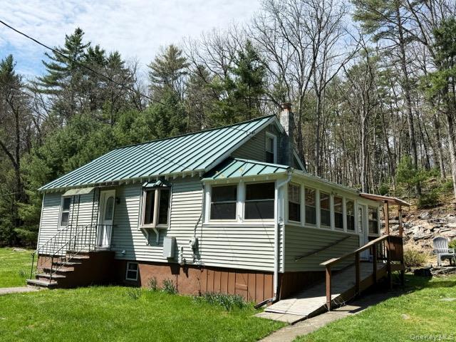 26 Woods Road Barryville, NY 12719 - Photo 4 of 34 a view of a house with a yard
