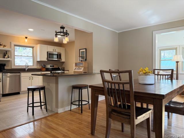 26 Woods Road Barryville, NY 12719 - Photo 6 of 34 a view of kitchen with cabinets table and chairs