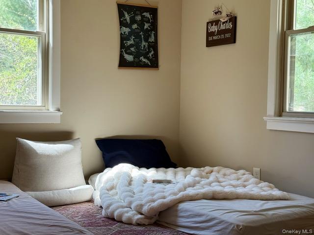 26 Woods Road Barryville, NY 12719 - Photo 9 of 34 a bedroom with a bed and a window