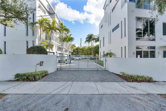 a view of a building with a yard