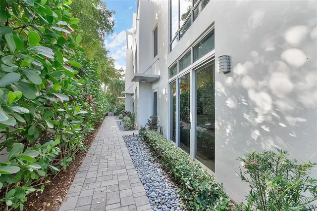 a view of a pathway both side of the house