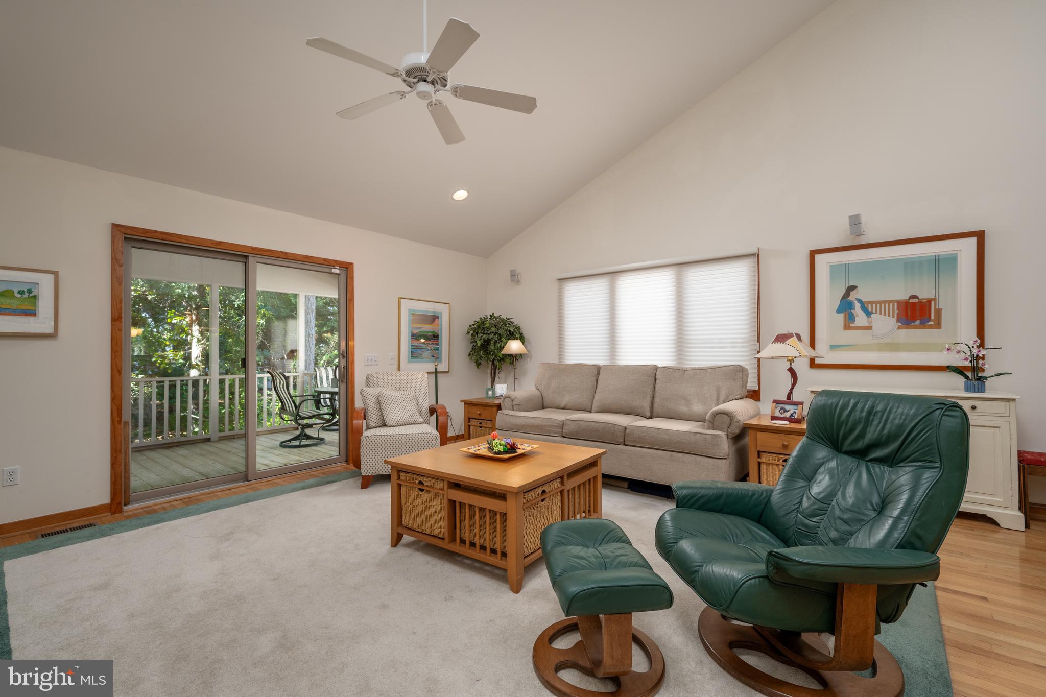 408 Periwinkle Road South Bethany, DE 19930 - Photo 14 of 38 Living room leads out to screened porch