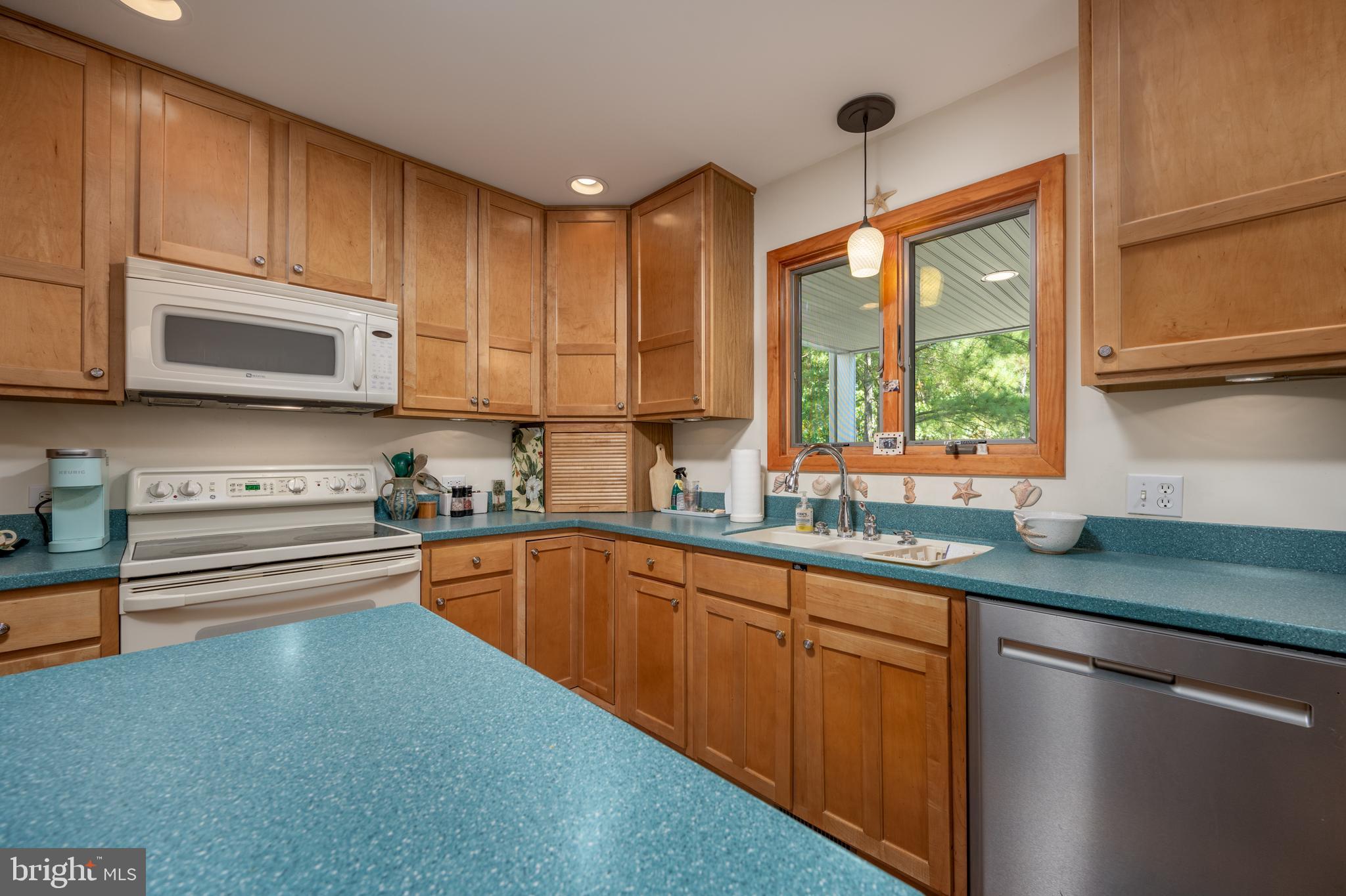 408 Periwinkle Road South Bethany, DE 19930 - Photo 20 of 38 Beautiful cabinets and solid surface countertops