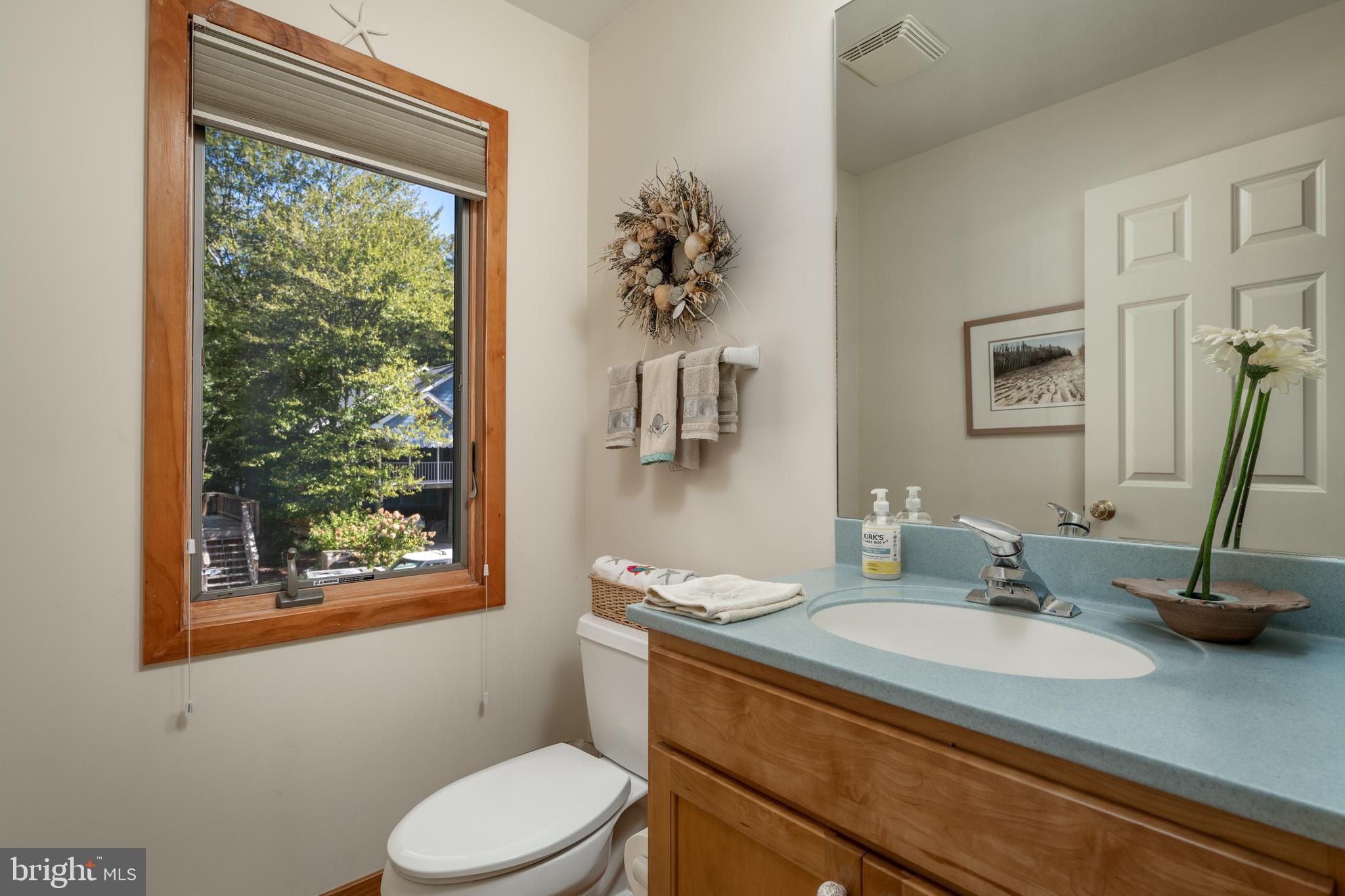 408 Periwinkle Road South Bethany, DE 19930 - Photo 26 of 38 Powder room on the main level