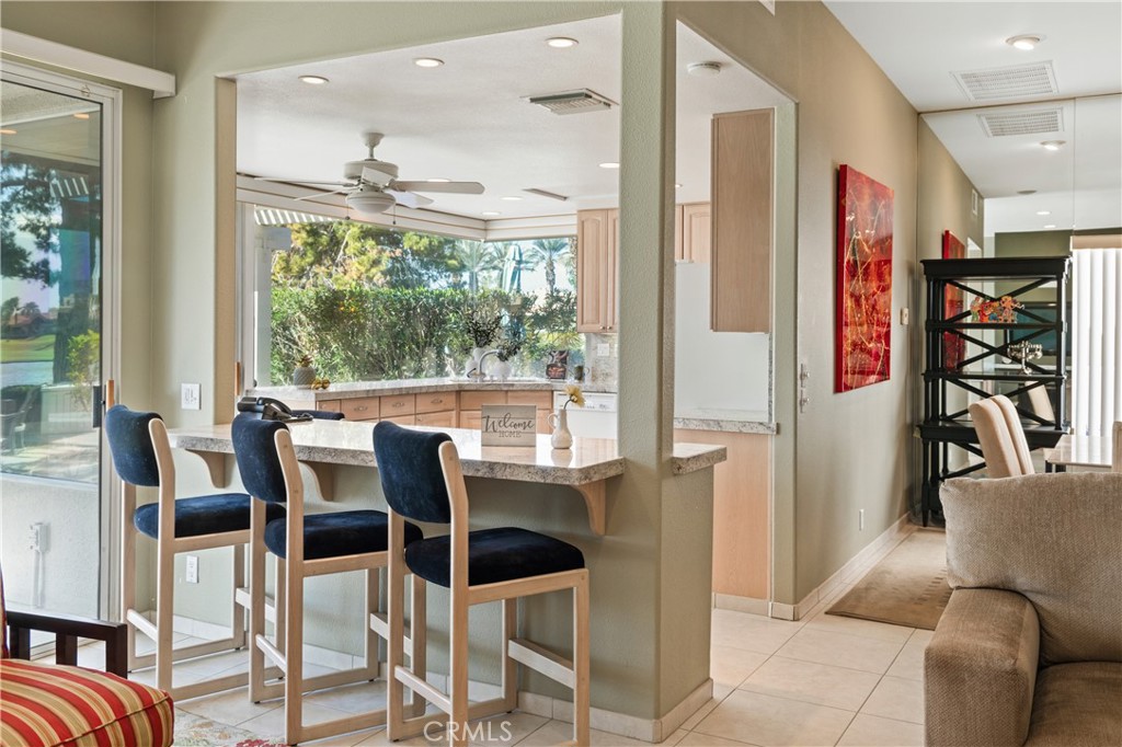 37 Oak Tree Drive Rancho Mirage, CA 92270 - Photo 13 of 54 a dining room with furniture and a floor to ceiling window