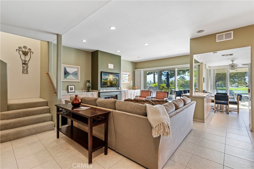 37 Oak Tree Drive Rancho Mirage, CA 92270 - Photo 14 of 54 a living room with furniture and a large window