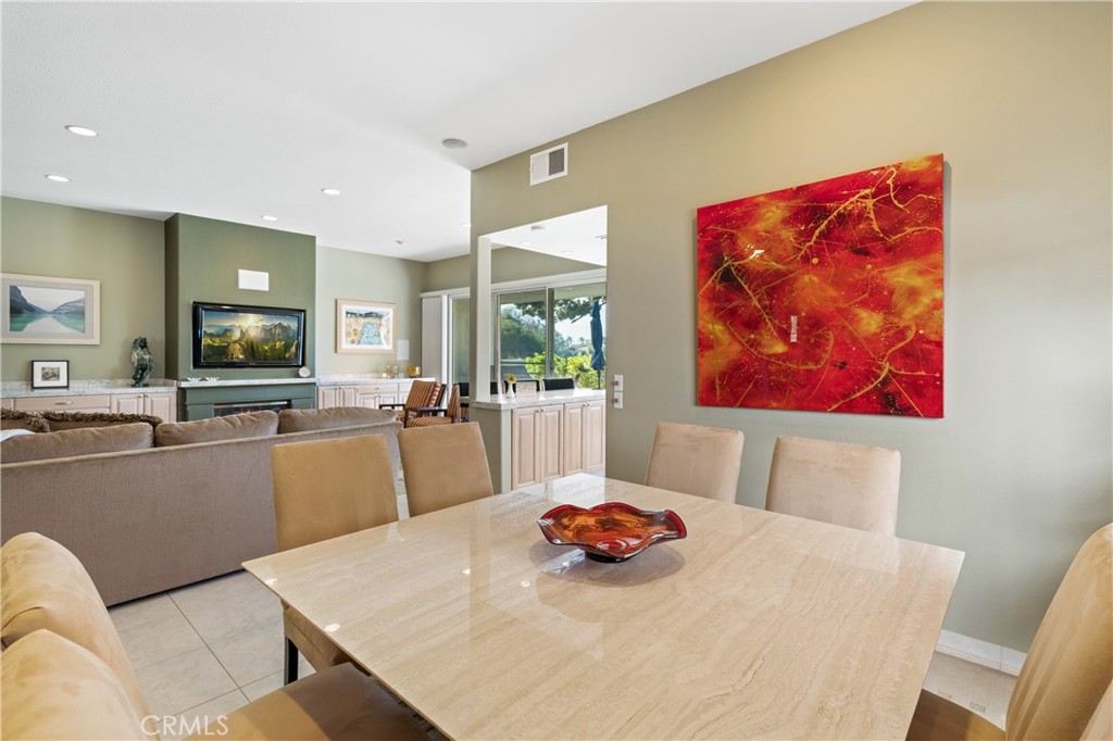 37 Oak Tree Drive Rancho Mirage, CA 92270 - Photo 15 of 54 a view of a dining room with furniture and a large window