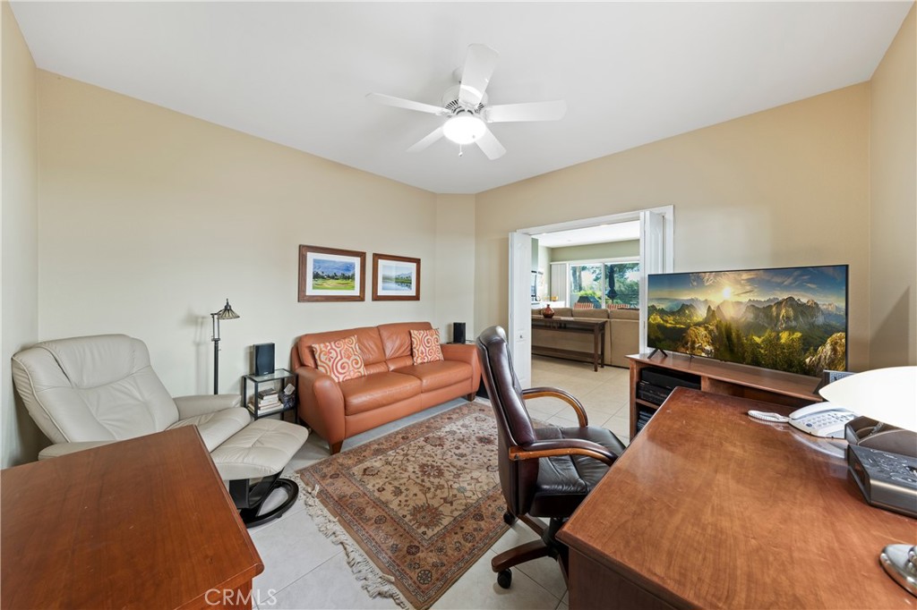 37 Oak Tree Drive Rancho Mirage, CA 92270 - Photo 20 of 54 a living room with furniture and a flat screen tv