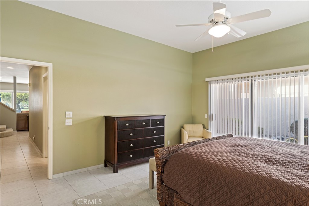 37 Oak Tree Drive Rancho Mirage, CA 92270 - Photo 23 of 54 a bedroom with a bed and a table