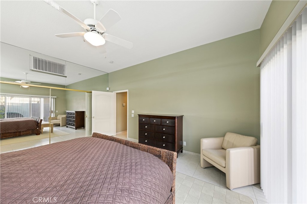 37 Oak Tree Drive Rancho Mirage, CA 92270 - Photo 25 of 54 a bedroom with a bed and window