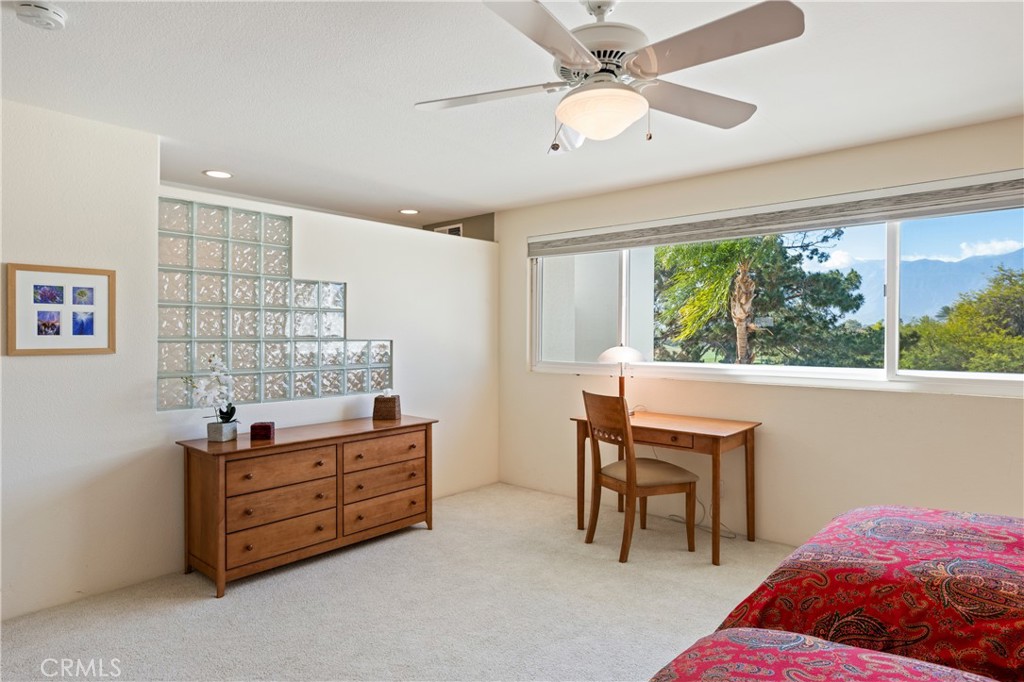 37 Oak Tree Drive Rancho Mirage, CA 92270 - Photo 28 of 54 a bed room with a bed and a window
