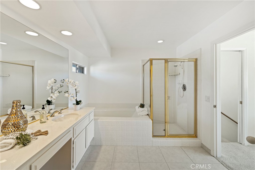 37 Oak Tree Drive Rancho Mirage, CA 92270 - Photo 30 of 54 a spacious bathroom with a mirror a shower and a sink
