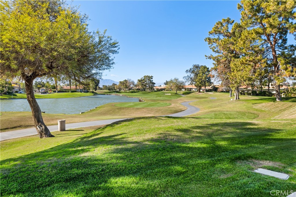 37 Oak Tree Drive Rancho Mirage, CA 92270 - Photo 33 of 54 a view of a golf course with a lake
