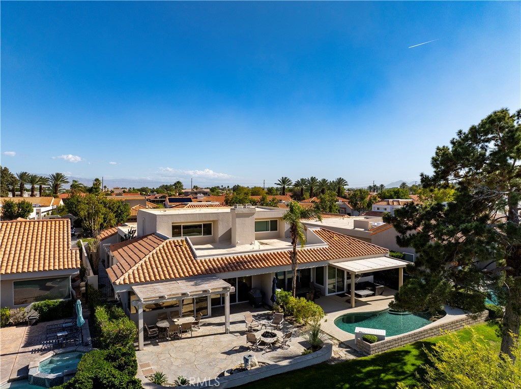 37 Oak Tree Drive Rancho Mirage, CA 92270 - Photo 38 of 54 a view of a house with patio and yard