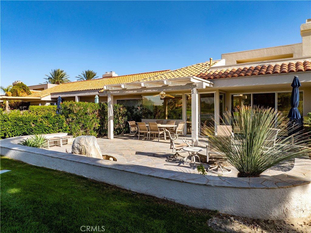 37 Oak Tree Drive Rancho Mirage, CA 92270 - Photo 39 of 54 a view of a house with backyard outdoor seating and hardwood