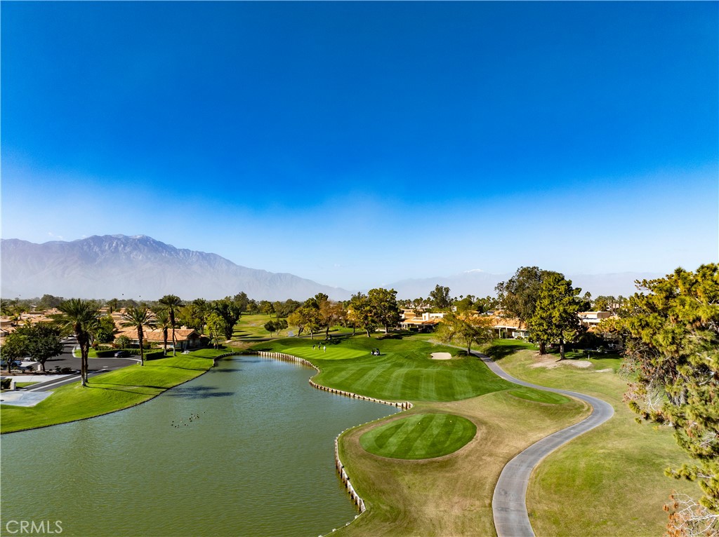 37 Oak Tree Drive Rancho Mirage, CA 92270 - Photo 43 of 54 a view of a lake with houses