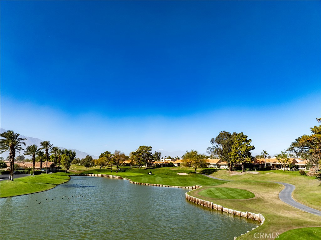 37 Oak Tree Drive Rancho Mirage, CA 92270 - Photo 45 of 54 a view of a lake and houses with outdoor space
