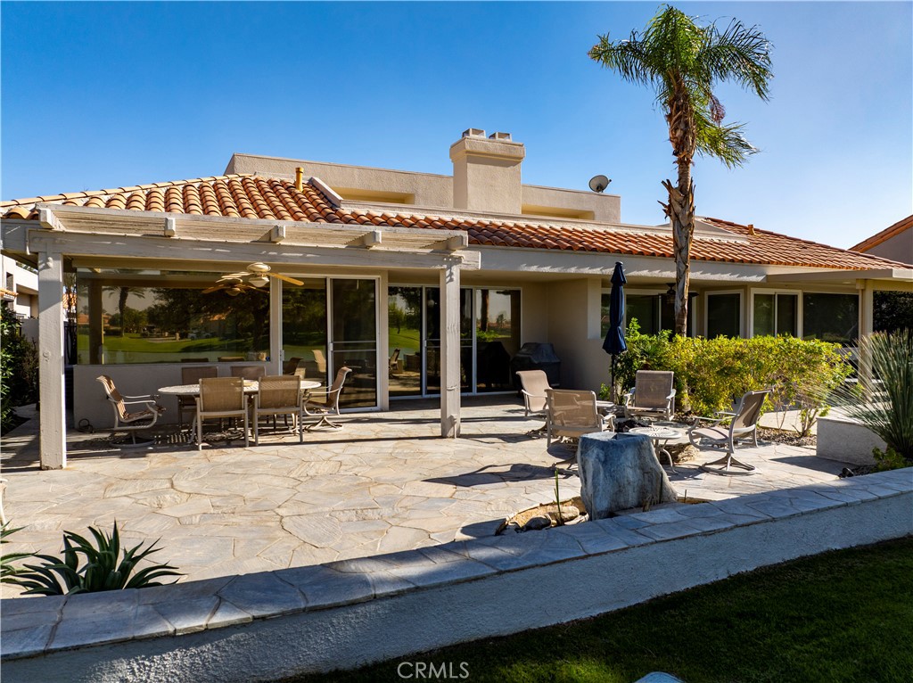 37 Oak Tree Drive Rancho Mirage, CA 92270 - Photo 47 of 54 a view of a house with sitting area and garden