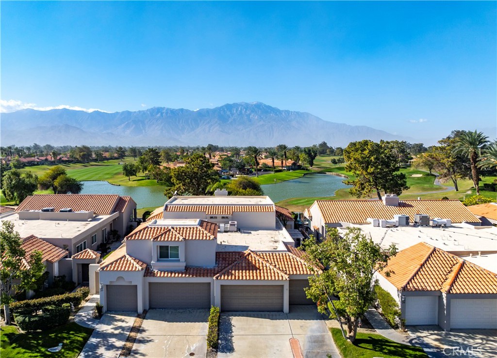 37 Oak Tree Drive Rancho Mirage, CA 92270 - Photo 48 of 54 an aerial view of a house with a garden and lake view