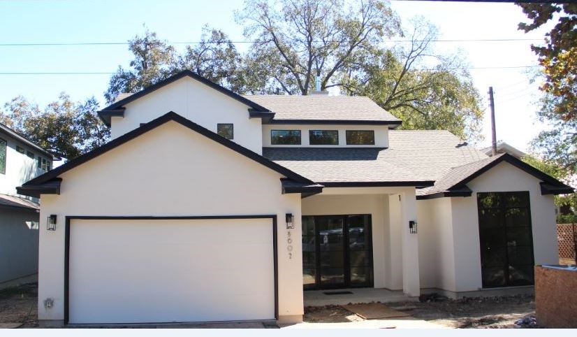 a house with trees in the background