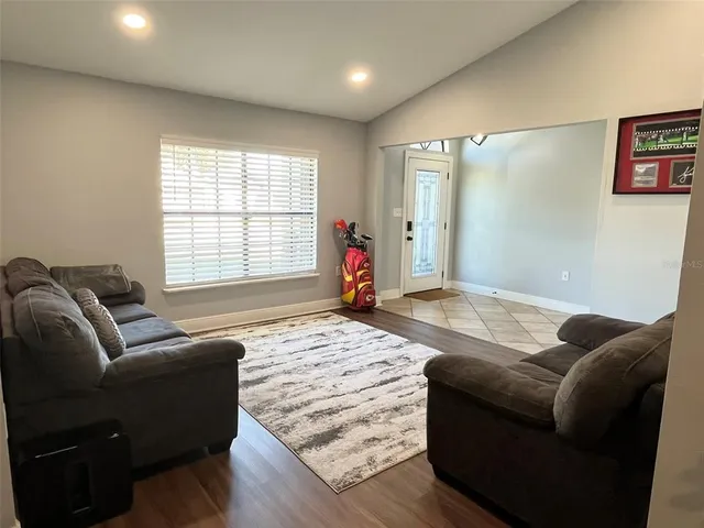 a living room with furniture and a window