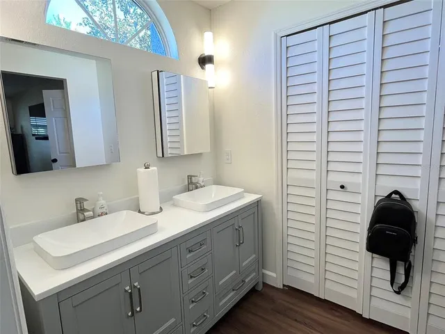 a bathroom with a sink and a mirror