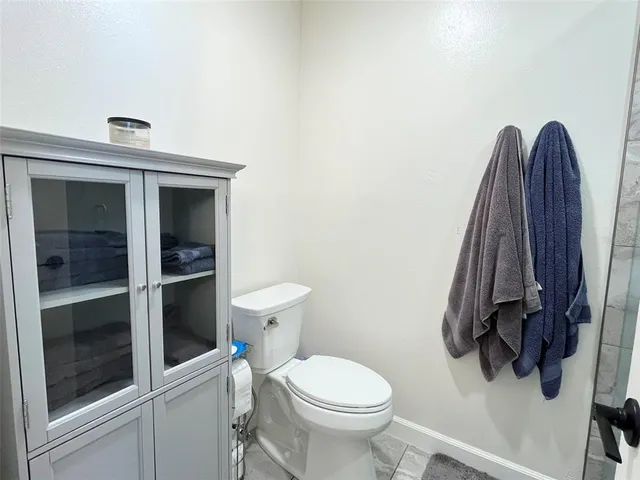 a bathroom with a toilet and a sink