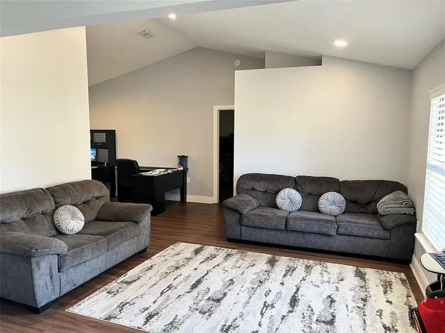 a living room with furniture and a couch
