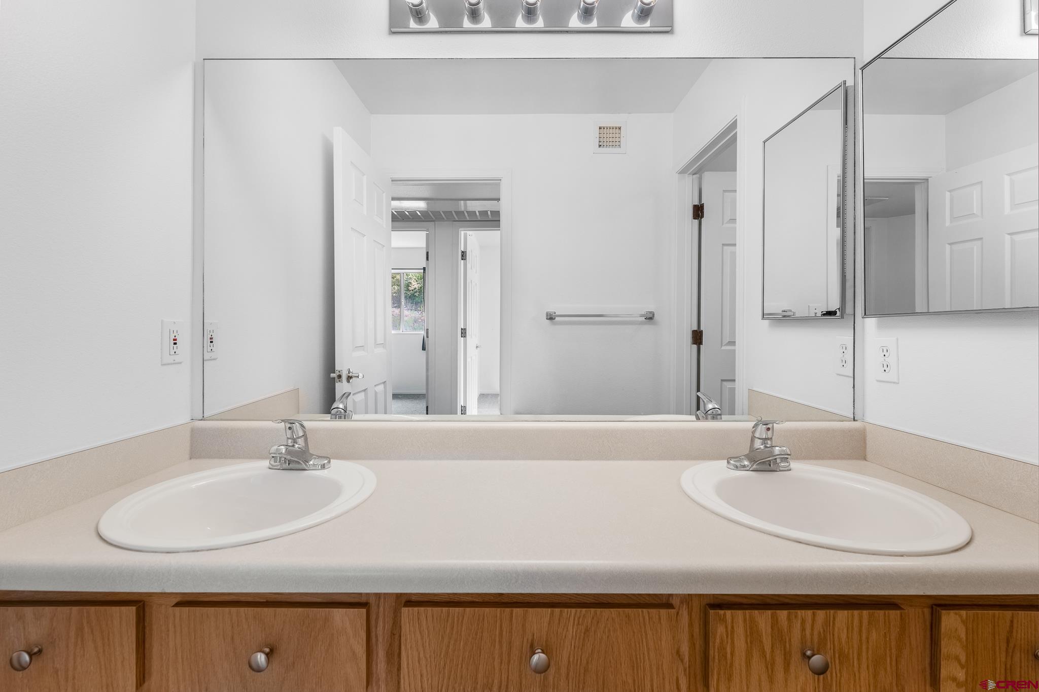 1100 Goeglein Gulch Road, Unit 164 Durango, CO 81301 - Photo 15 of 31 a bathroom with a sink and a mirror