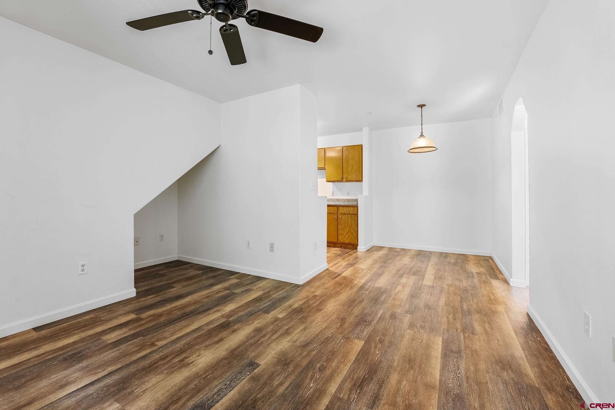 1100 Goeglein Gulch Road, Unit 164 Durango, CO 81301 - Photo 5 of 31 a view of an empty room with a window and wooden floor