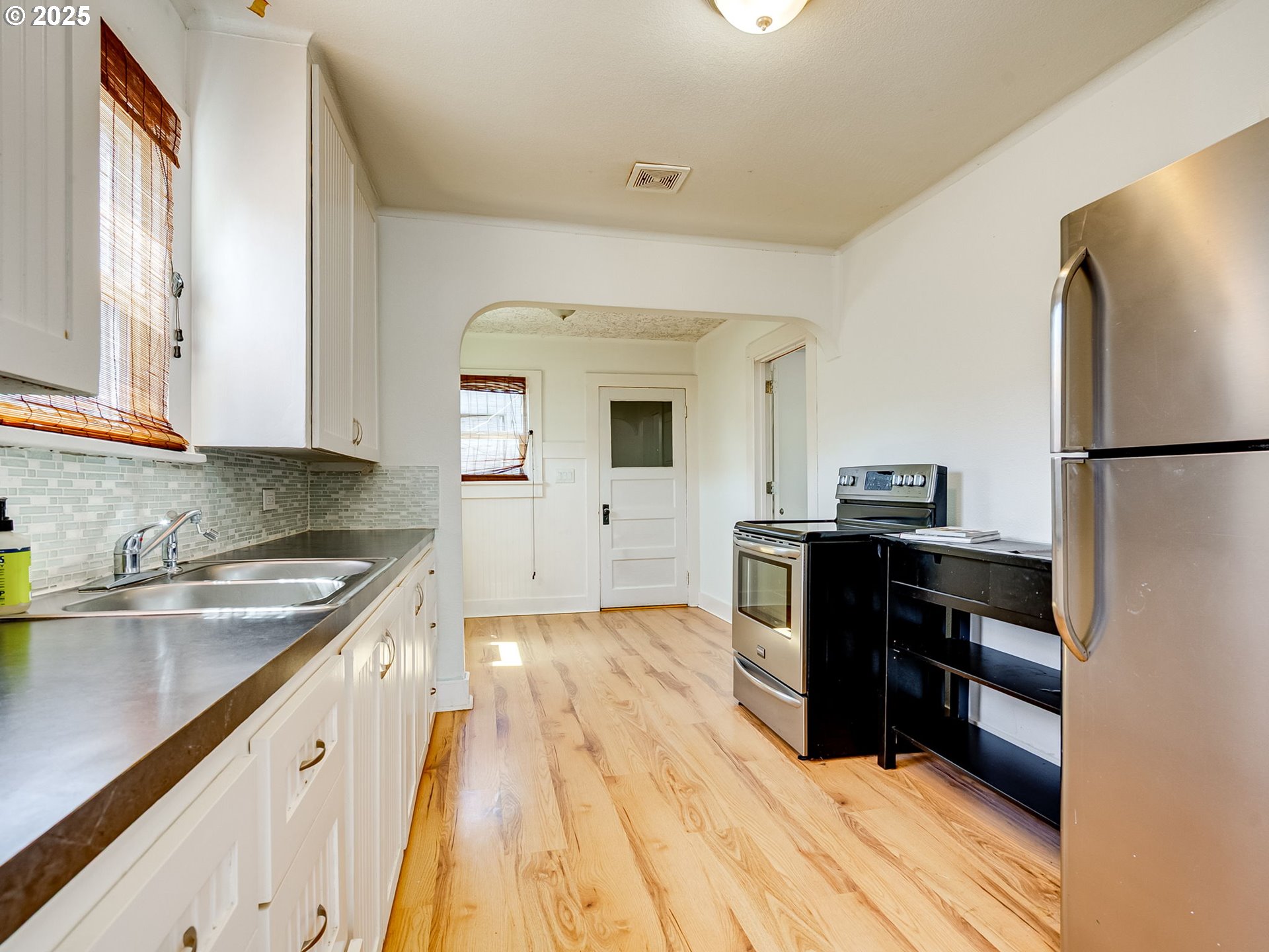 907 Northwest Greeley Street Camas, WA 98607 - Photo 11 of 31 a kitchen with a refrigerator stove and sink