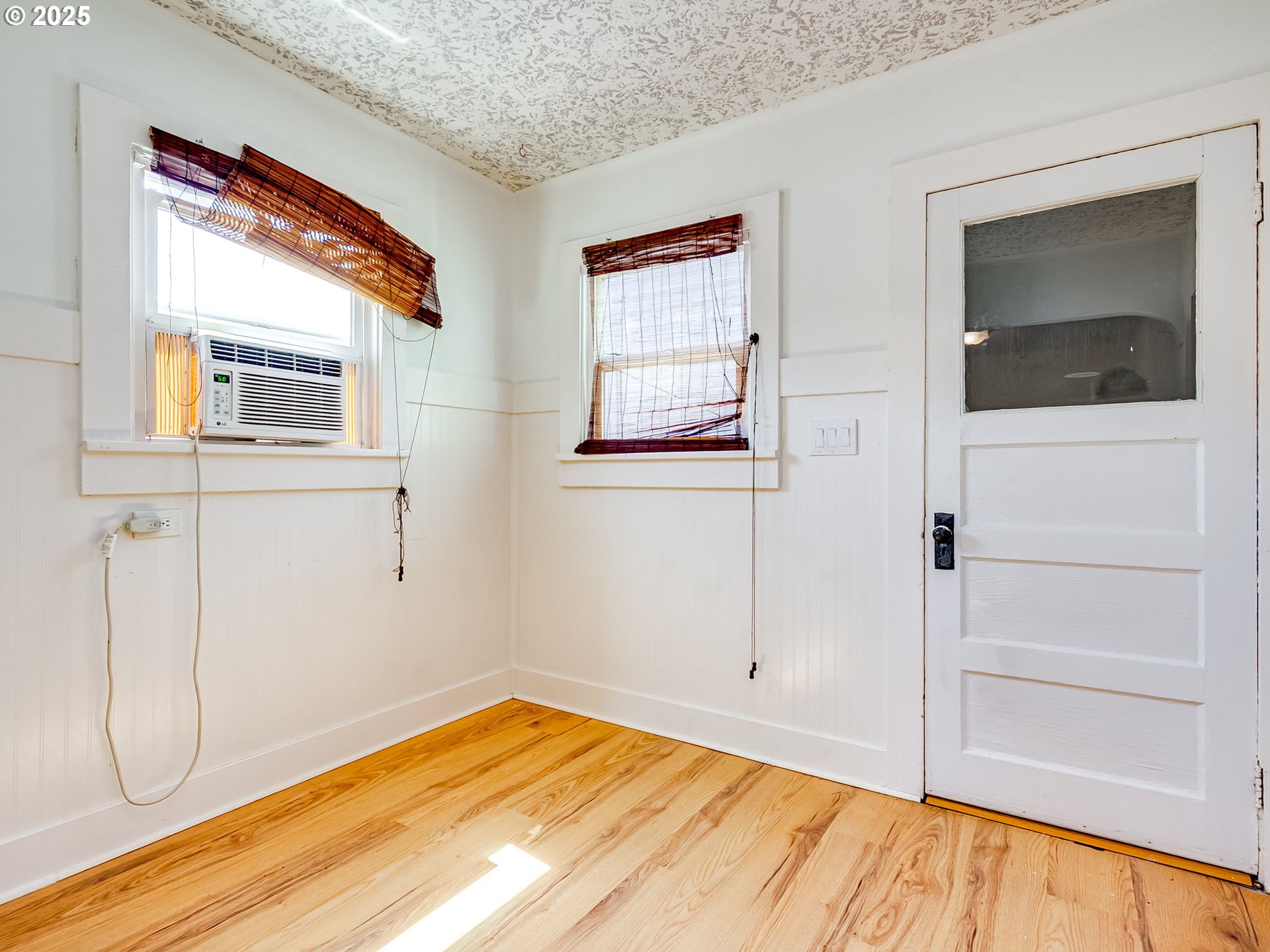 907 Northwest Greeley Street Camas, WA 98607 - Photo 12 of 31 a view of empty room with wooden floor and fan