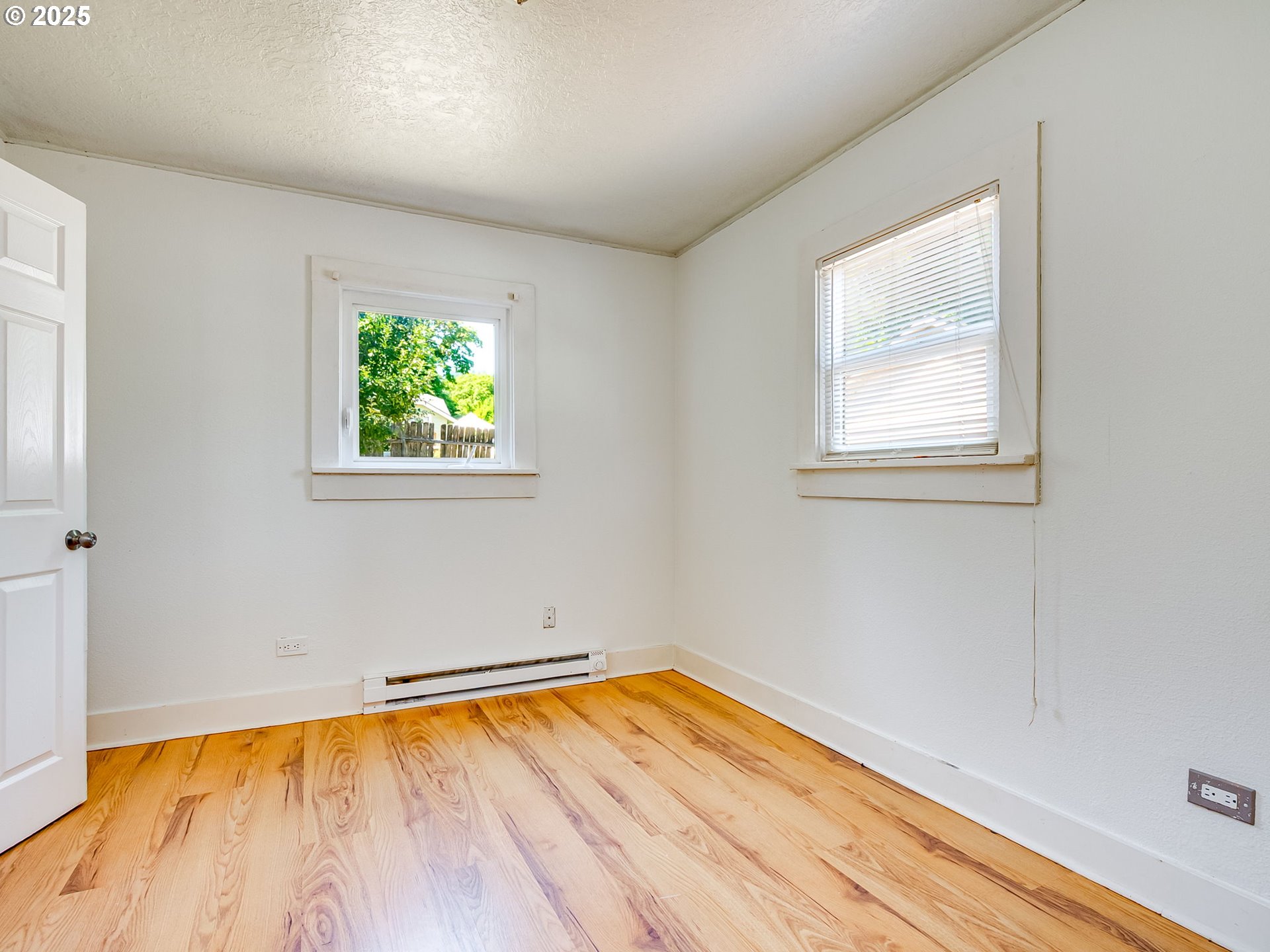 907 Northwest Greeley Street Camas, WA 98607 - Photo 13 of 31 an empty room with a hardwood and a window