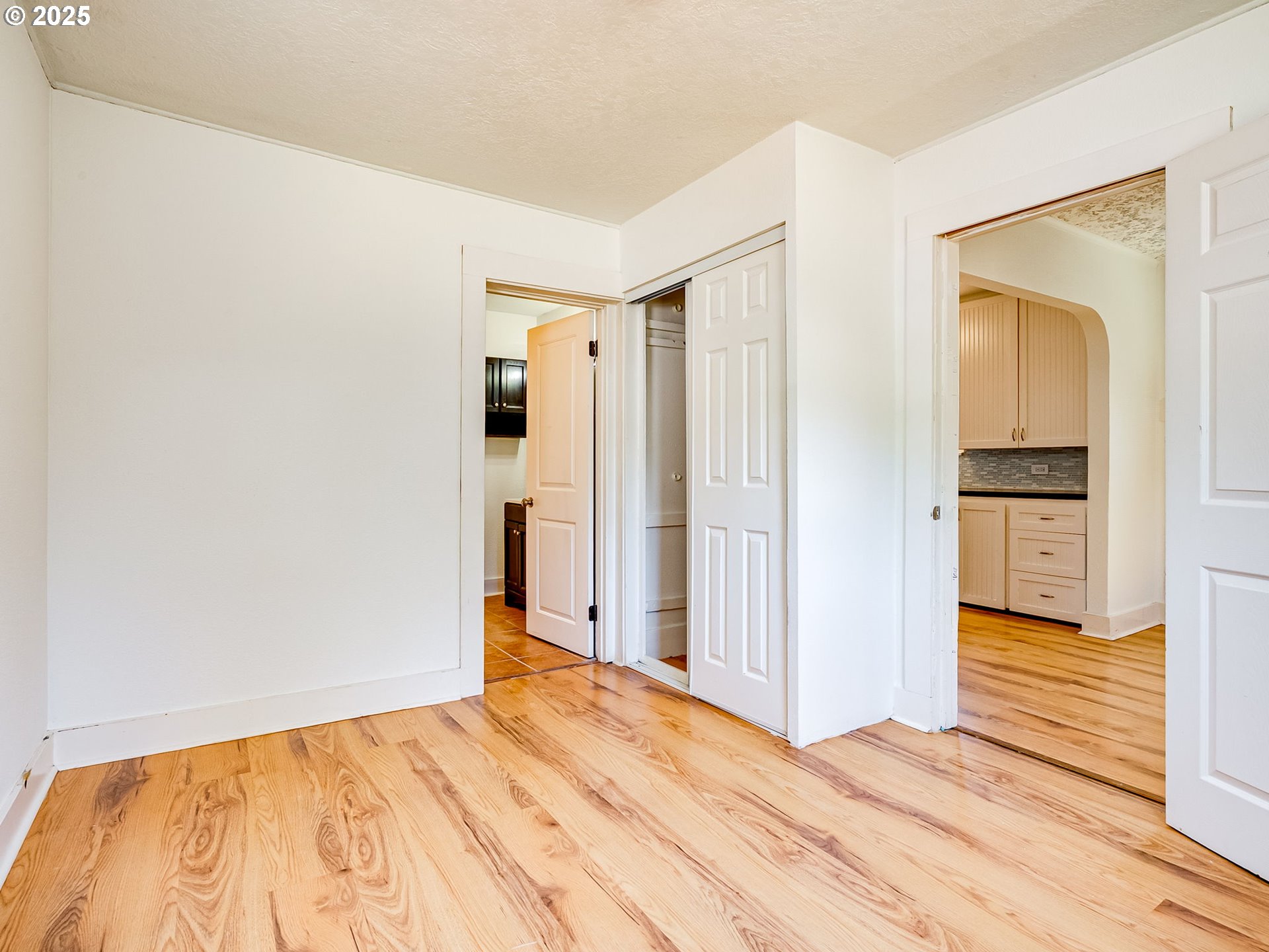 907 Northwest Greeley Street Camas, WA 98607 - Photo 14 of 31 a view of empty room with wooden floor and cabinet