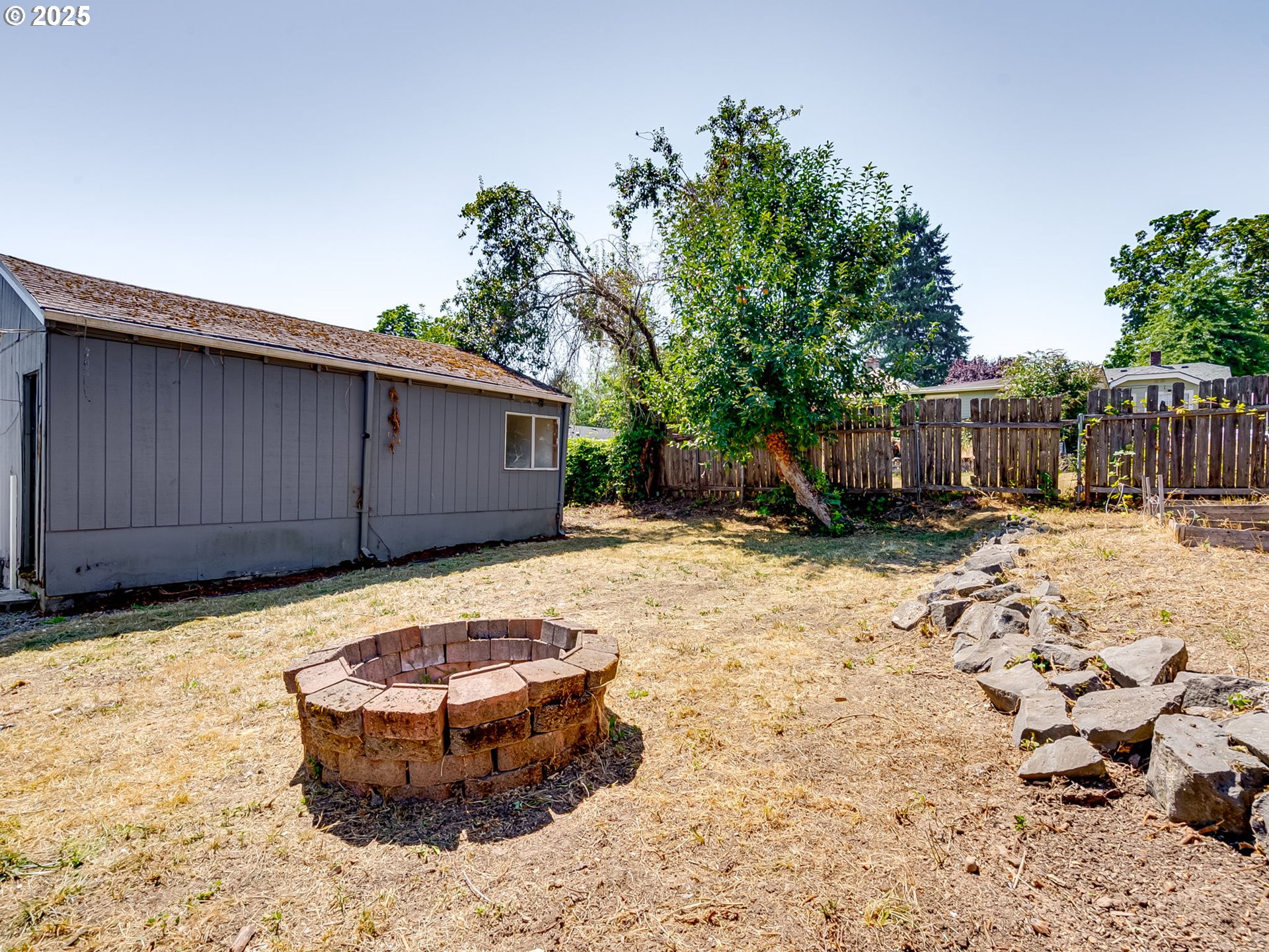 907 Northwest Greeley Street Camas, WA 98607 - Photo 26 of 31 a view of a backyard with wooden fence