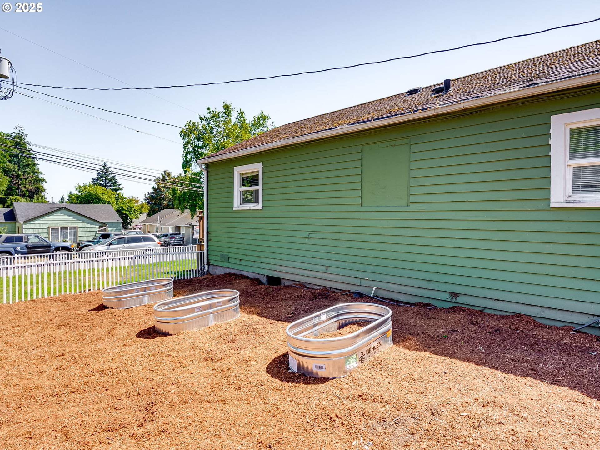907 Northwest Greeley Street Camas, WA 98607 - Photo 29 of 31 a backyard of a house with table and chairs