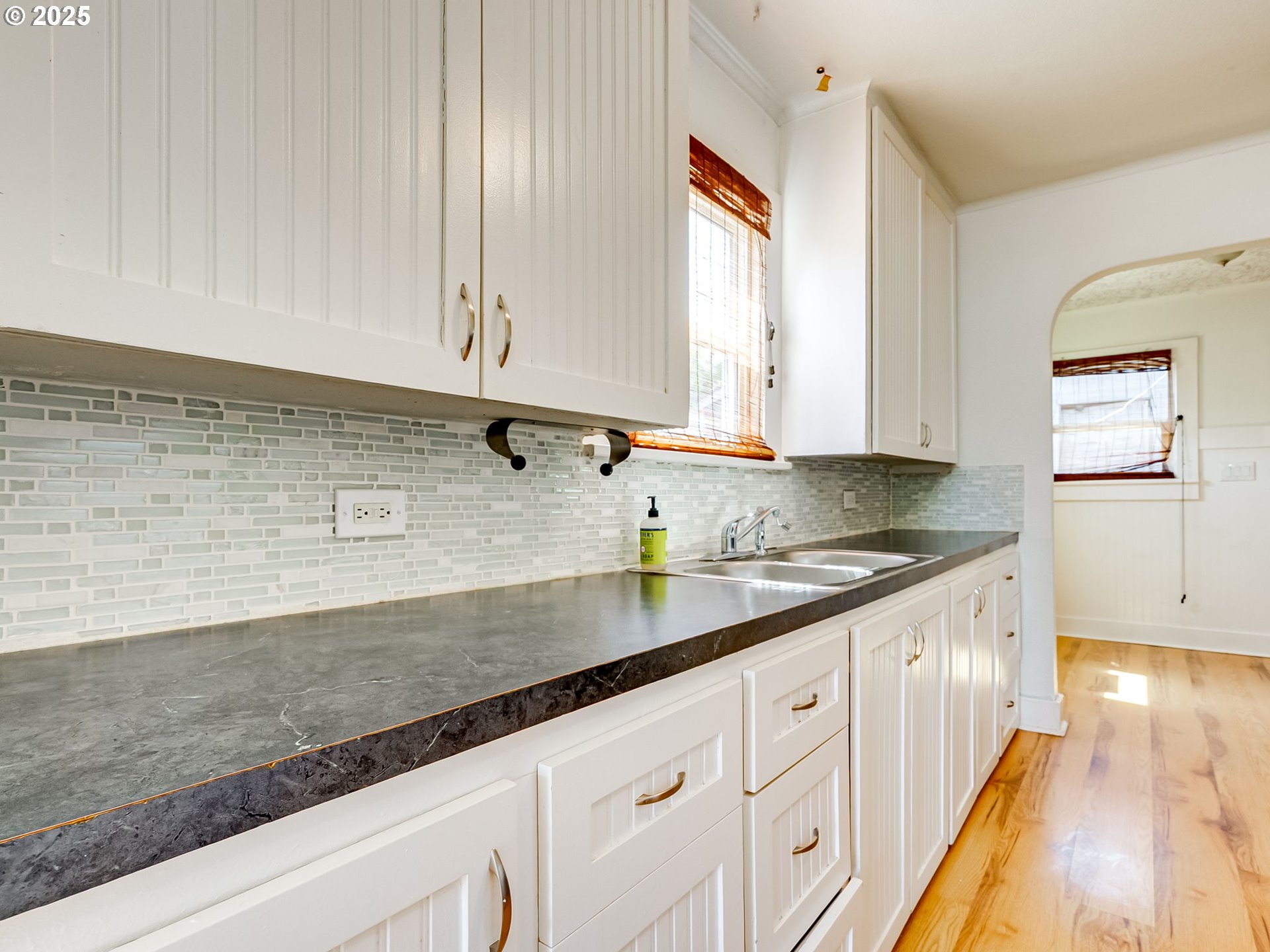 907 Northwest Greeley Street Camas, WA 98607 - Photo 8 of 31 a kitchen with granite countertop white cabinets and white appliances