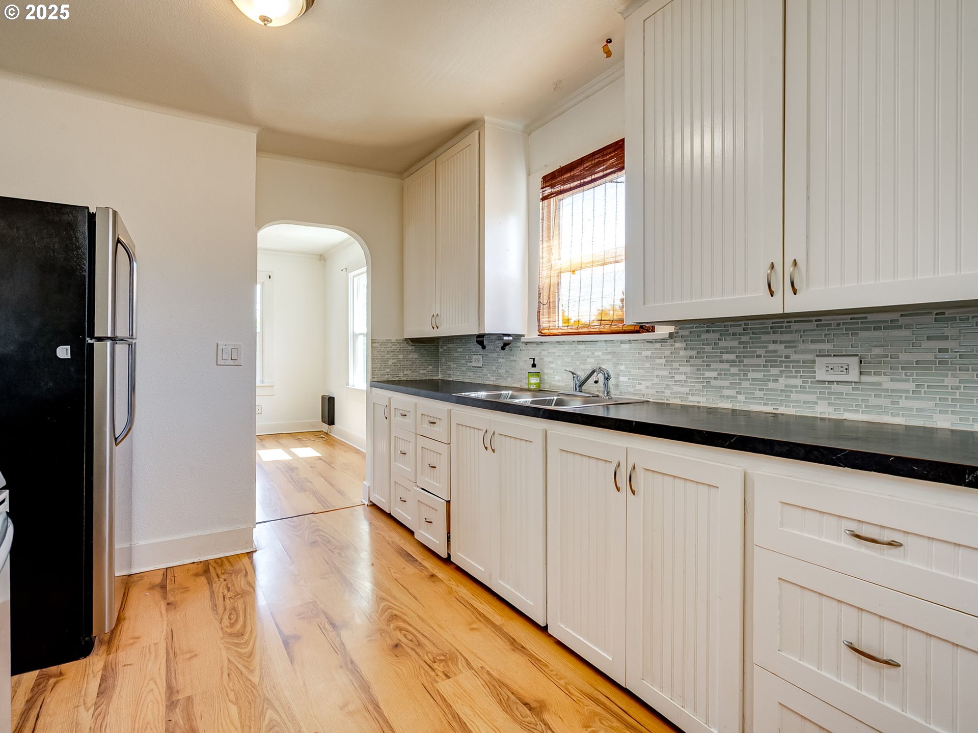 907 Northwest Greeley Street Camas, WA 98607 - Photo 9 of 31 a kitchen with granite countertop white cabinets and sink