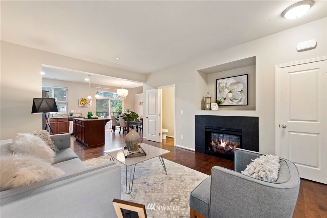 10719 Ross Road, Unit B Bothell, WA 98011 - Photo 3 of 26 a living room with furniture and a fireplace