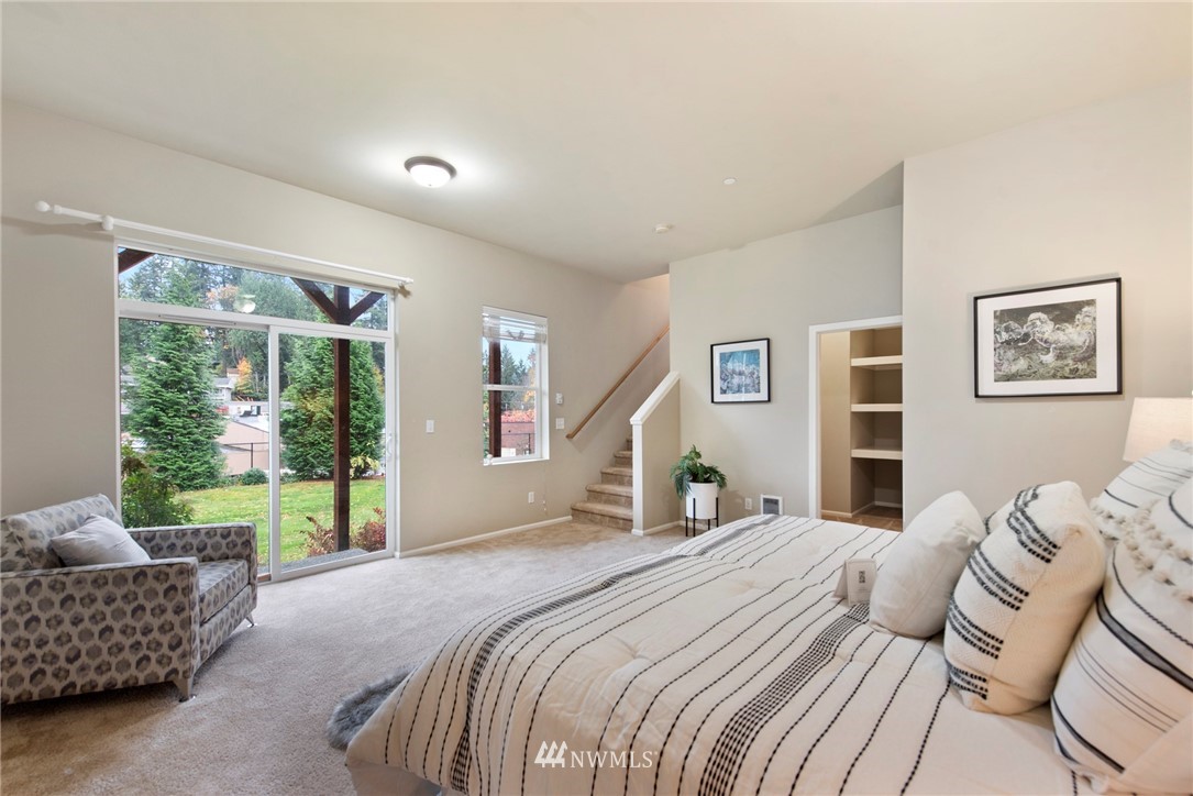 10719 Ross Road, Unit B Bothell, WA 98011 - Photo 22 of 26 a bedroom with furniture and a large window