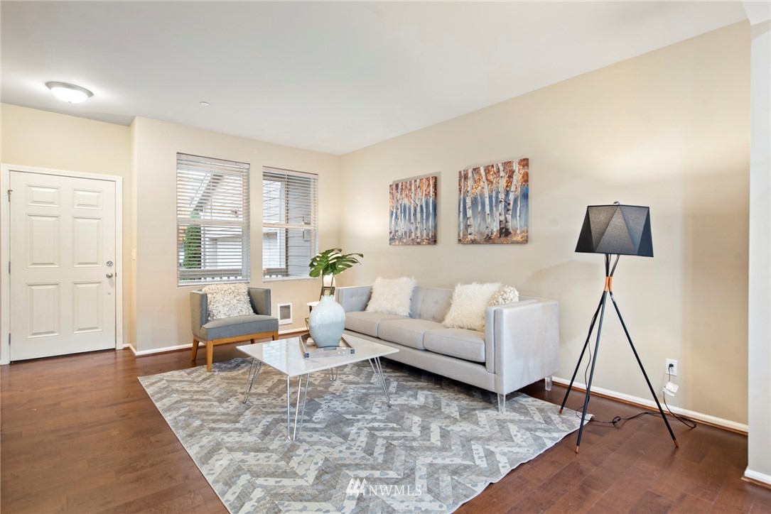 10719 Ross Road, Unit B Bothell, WA 98011 - Photo 5 of 26 a living room with furniture and a wooden floor