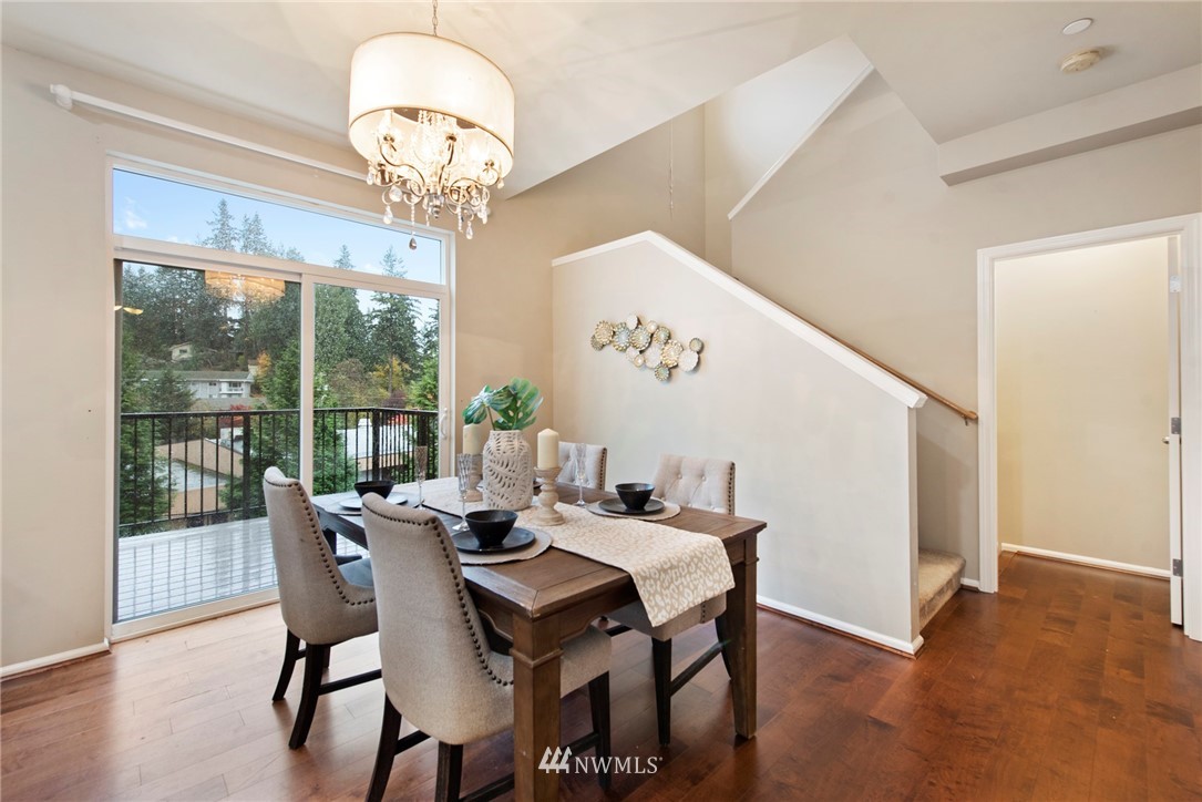 10719 Ross Road, Unit B Bothell, WA 98011 - Photo 7 of 26 a view of a dining room with furniture window and wooden floor