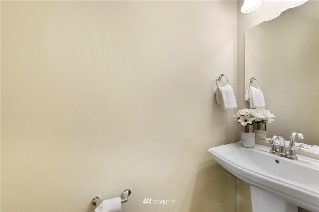 10719 Ross Road, Unit B Bothell, WA 98011 - Photo 9 of 26 a bathroom with a sink and a mirror