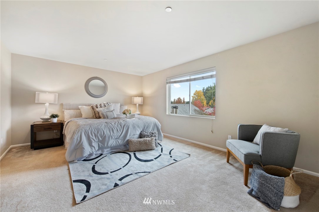 10719 Ross Road, Unit B Bothell, WA 98011 - Photo 10 of 26 a bedroom with a bed and window