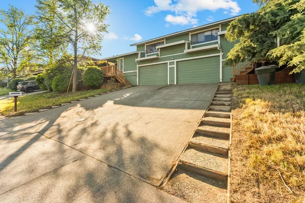 a view of a patio with table and chairs and potted plants