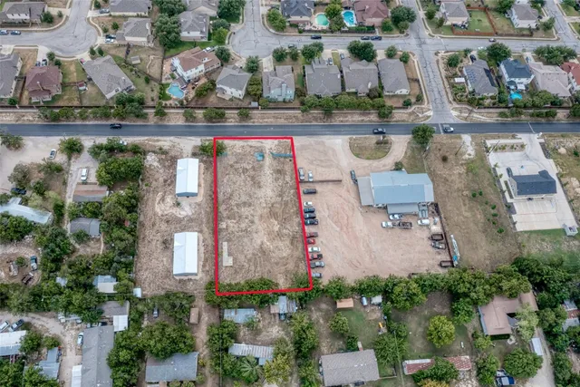 an aerial view of a house with a lake view